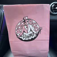 Cute branding and bag  at Voodoo Doughnut in Dallas