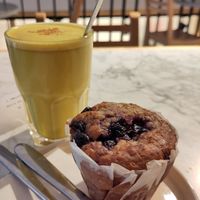 Blueberry muffin and golden latte at Le Pain Quotidien - Belliard  in Brussels