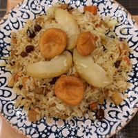 Pilaf rice with fruits and raisin. There might be butter but I'm not sure. They don't really know the difference between vegetarian and vegan at Afsona in Tashkent