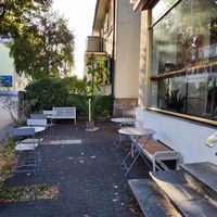Outdoor seating (in autumn) at Bees & Birds Cafe in Basel