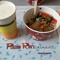 Kirin Draft beer with plant based rice dish with seitan  at Plazma Ray's Diner - Disneyland Tokyo in Chiba