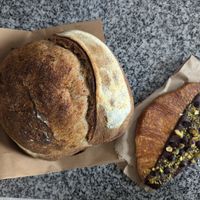 Pan de campo ($7000) y flat croissant ($7000) at Nueza in Buenos Aires
