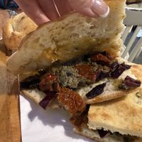 Sun dried tomatoes, olive tapenade, wish it had a little more of the curried red cabbage   at Schiaccia Passera in Florence