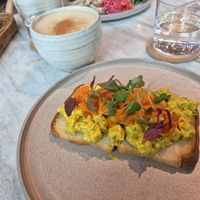 Vegan tofu egg and salmon toast. Chai in the background at Alchemy Tokyo -Azabudai Hills - アルケミー in Tokyo