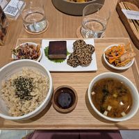 Japanese breakfast set with miso soup, brown rice, crispy sesame-coated tempeh, tofu salmon, and pickled vegetables at Alchemy Tokyo -Azabudai Hills - アルケミー in Tokyo