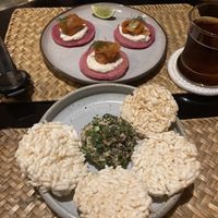 Carrot lox (faux salmon) and cashew cheese with dragon fruit pancakes (This was the smaller portion size. U can order in bigger too). In the front,  garlic and pepper cheese ball.  at Lost In Baan in Luang Prabang