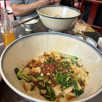 Giant bowls and warm orange sodaa  at Shangzhai Leizhali Noodle Restaurant - 尚寨嫽扎咧面馆(钟楼店) in Xian