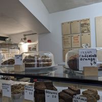 Vegan carrot cake, vegan chocolate orange cake, vegan cookies, background you can see vegan soup for that day at The Cafe Club  in Norwich