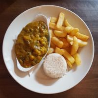 Vegetable curry severed with rice and chips at Sinners Cafe in Berwick Upon Tweed