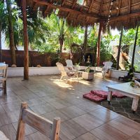 the main dining area  calm and breezy at Antal Cafeteria Holistica in Isla Mujeres