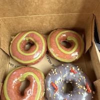3 Strawberry donuts and a Birthday Cake one!  at Holey Grail Donuts  in Kapaa