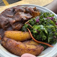 Oxtails bowl with sweet plantains and kale slaw. (Rice and kidney beans under everything)  at Sedjedo Kitchen in Bellmore