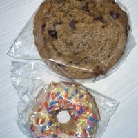 Donut and chocolate chip cookie, both vegan and both delicious  at Erie Food Co-op in Erie