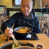 Enjoying vegan dumplings with a delicious sauce at Ninja Ramen in Lancaster