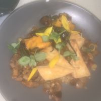 Congee and Farro Bowl w/ Tofu and grilled peppers   at The Hummingbird Way in Mobile