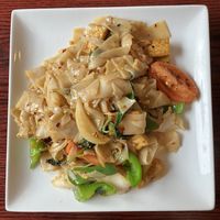Drunken Noodle with tofu. Pan fried wide rice noodles, bell pepper, onion, tomato, basil. at Joy's Pattaya Thai Restaurant in Richfield