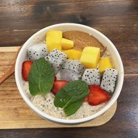 Overnights oats with chia seeds - underneath was banana and on top strawberry, dragonfruit, mango and peanut butter.   at The Hanoi Cafe in Hanoi