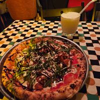 Pastrami pizza (They only had this one) and piña colada cocktail at Daner Pizza in Tbilisi