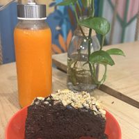 Chocolate cake and sunset juicee  at iVegan Supershop Old Quarter Hanoi - Healthy Plant Based Cafe in Hanoi
