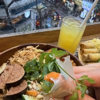 Meal with a view! Saigon bowl, Spring Rolls and Pineapple juice.Very filling, very vegan, very good value.  at iVegan Supershop Old Quarter Hanoi - Healthy Plant Based Cafe in Hanoi