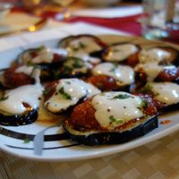 Borani Banjan (fried aubergines in tomato sauce, served with garlicky yoghurt and herbs) (vegan) at Weissberg Restaurant in Saarbrucken