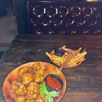 Vegan Manchurian Cauliflower with Vegan French Fries   at The Haberdasher in Mobile
