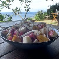 Tropical Fruit bowl with slices of coconut  at Cafe Sarwaa in Varkala