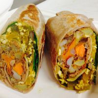 Organic Tex Mex Breakfast Burrito - Our savory scramble combines tofu, onions, red and green peppers, black beans, roasted root veggies and salsa. Wrapped in a whole wheat tortilla with baby spinach. Sriracha hot sauce available upon request. at The Randy Radish in Ashburn