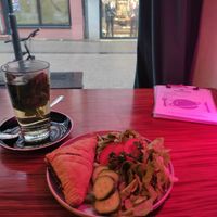 Gefüllte Blätterteigtasche mit Spinat und Tofu und Salat at KOSMOS - temporarily closed in Saarbrucken