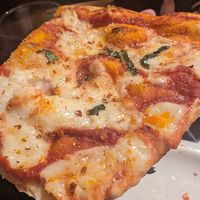 Cheese ny slice close up at Renato's in Bristol