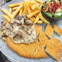 Vegan Schnitzel with mushrooms and fries at ALEX in Chemnitz