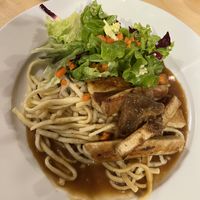 Traditional "Spätzle" noodles with tofu steak and salad  at Naturgasthof Und Ölmühle Hirzwald in Triberg Im Schwarzwald