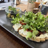 whipped feta, sun-dried tomatoes, rocket, balsamic, olives  at The Station Coffee + Kitchen in Stokesley