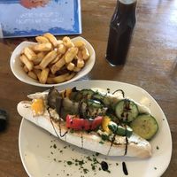 Veganised sandwich of the day - hummus and Mediterranean vegetables - with chips  at Cafe Arriba in Isle Of Skye
