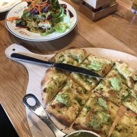 Pinsa like oven bread (marked vegetarian but is vegan) and side salad   at Wirtshaus Lautenschlager in Stuttgart