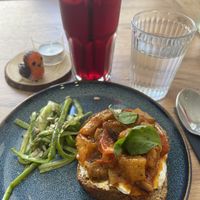 Bruschetta appetizer with Hibuscus infusion drink  at Le Rouge-gorge Restaurant in Menton