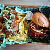 Bacun cheese burger with special dirty fries - cheese, sweet chilli sauce, spring onion, cucumber, sesame seeds and chick'n pieces.  at Samphire Brasserie in Plymouth