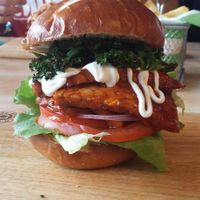 Don't Kale My Vibe burger - BBQ Tempeh, Lettuce, Tomatoes & Red Onion topped with Crispy Kale at Samphire Brasserie in Plymouth