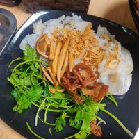 Ban Cuon, steamed rice rolls with mock meats and crispy garlic- comes with a dipping sauce at Chay An Binh in Hanoi