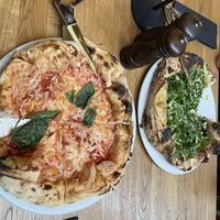 Margarita left and Ortolana right with scissors for cutting the pizzas  at nuva pizza in Leipzig