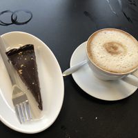 Trillionaires cake and a coffee   at VeGaNuTi in Yeovil