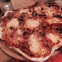 stunning pizza with vegan mozzarella, onions, and sweet tatos  at Flax in Dresden