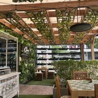 Cozy lovely outdoor seating  at Clover Coffee + MarketPlace in Oranjestad