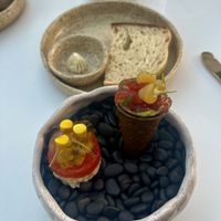 First appetizer served outside with GF sourdough bread and vegan maple butter  at Infini in Noord
