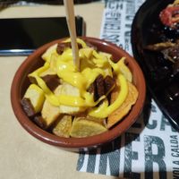 Patate fritte con veg cheddar e veg pancetta   at White Rabbit  in Lamezia Terme