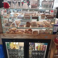 Whole top row of cakes marked as vegan at Twig Coffee Shop in High Peak