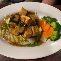 Garlic and Black Pepper Tofu- A thick brown sauce with roasted garlic, ground black pepper, served on a bed of steamed mixed vegetables. at Ayuttaya Thai Cuisine in Ocala