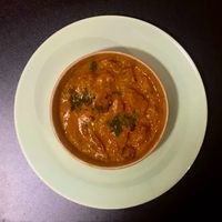 The Jaipur curry on a side plate (in it's original container) to give a true representation of portion size at Chatori Vegan Indian  in London