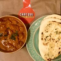 Tasty Jaipur plant-based chicken curry and garlic naan at Chatori Vegan Indian  in London