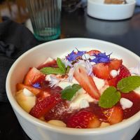 dessert: pavlova with strawberry, vegan meringue, red berry coulis & whipped cream at Planttrekkerij  in Antwerpen